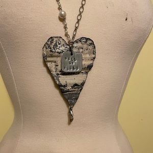 Tin shaped heart necklace with accent “hell on heels”